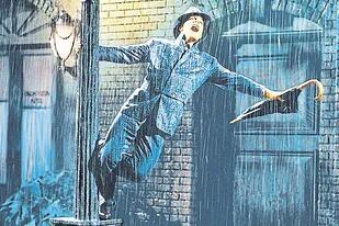 Gene Kelly en Cantando bajo la lluvia, uno de los clásicos de MGM que no forma parte de operación de venta del estudio a Amazon