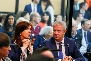 Former President Cristina Fernandez speaks with her lawyer Carlos Beraldi inside a federal courtroom in Buenos Aires, Argentina, Tuesday, May 21, 2019. Fernandez is in court for the first in a series of corruption trials. (AP Photo/Marcos Brindicci)