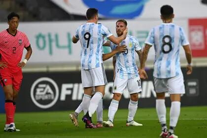 Argentina's Alexis Mac Allister (2nd R) celebrates his goal with his teammates against South Korea during their friendly football match in Yongin on July 13, 2021, ahead of the 2020 Tokyo Olympic Games. (Photo by Jung Yeon-je / AFP)