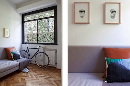 En el cuarto de huéspedes, sillón de lino gris y almohadón en cuero color suela (ambos en colaboración con Estudio Xenia). Poncho de lana natural traído de México e ilustraciones de Luciana Rondolini enmarcadas.