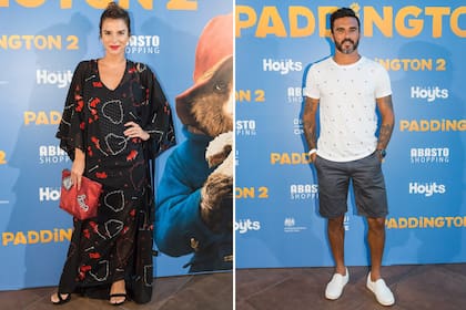 Gime Accardi, cual geisha en rojo y negro, y el Poroto Cubero, bien informal de short y remera en el estreno de Paddington 2