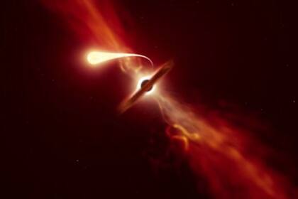 04/07/2023 Esta ilustración muestra una estrella (en primer plano) experimentando una espaguetificación cuando es succionada por un agujero negro supermasivo (en el fondo) durante un "evento de interrupción de marea". POLITICA INVESTIGACIÓN Y TECNOLOGÍA ESO/M. KORNMESSER