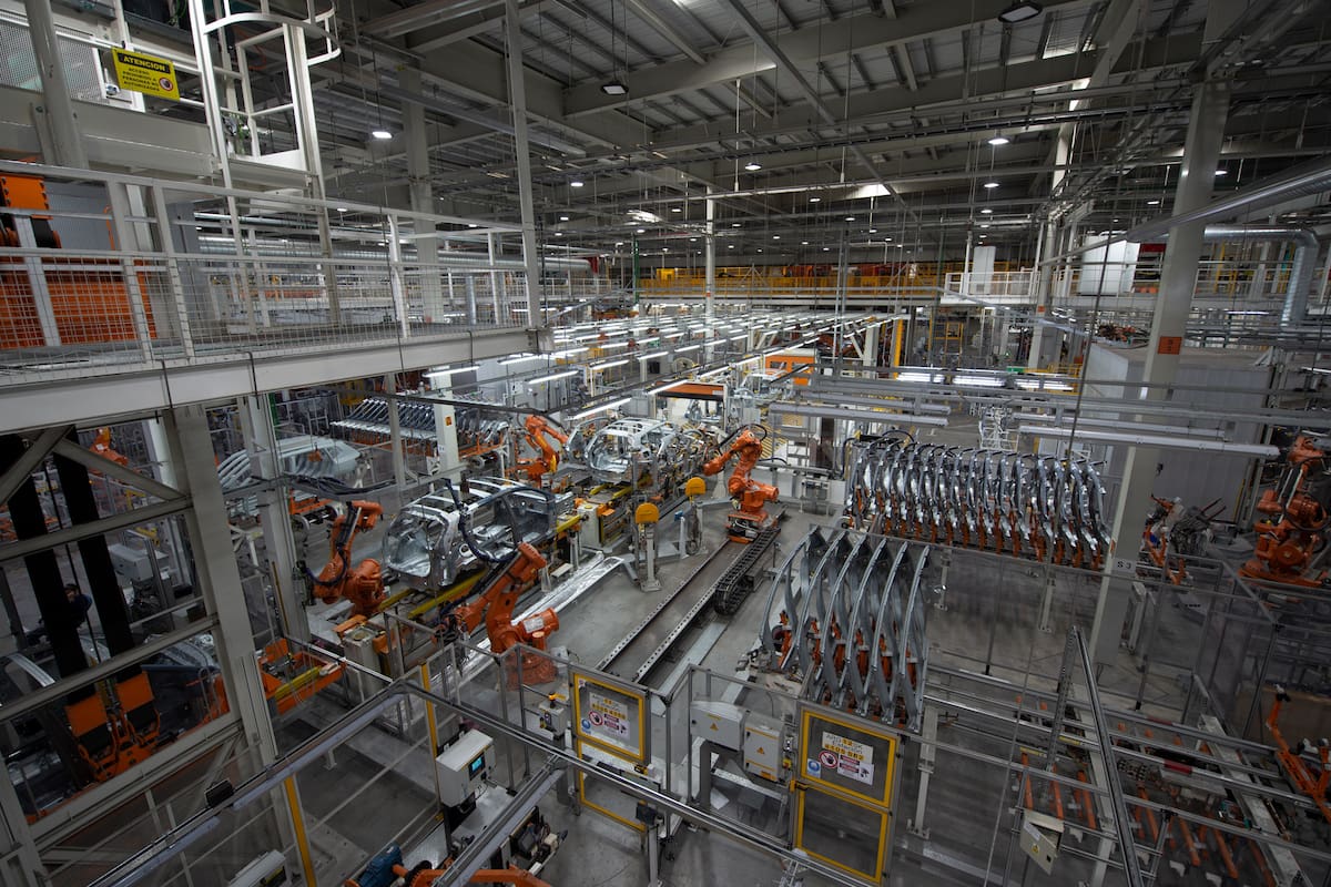 06 December 2021, Argentina, Pacheco: Robots work on the assembly of the Taos SUV model at the VW plant. The factory with body shop, paint shop and assembly in the Argentine capital has a production capacity of 65,000 units per year. The Amarok pickup and the Taos SUV model are produced in Buenos Aires. In total, VW employs around 5,000 people in Argentina. Photo: Florencia Martin/dpa (Photo by Florencia Martin/picture alliance via Getty Images)