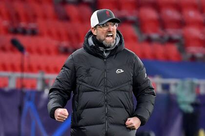 16 February 2021, Hungary, Budapest: Liverpool manager Jurgen Klopp reacts during the UEFA Champions League round of 16 first leg soccer match between RB Leipzig and FC Liverpool at Puskas Arena. Photo: Marton Monus/dpa