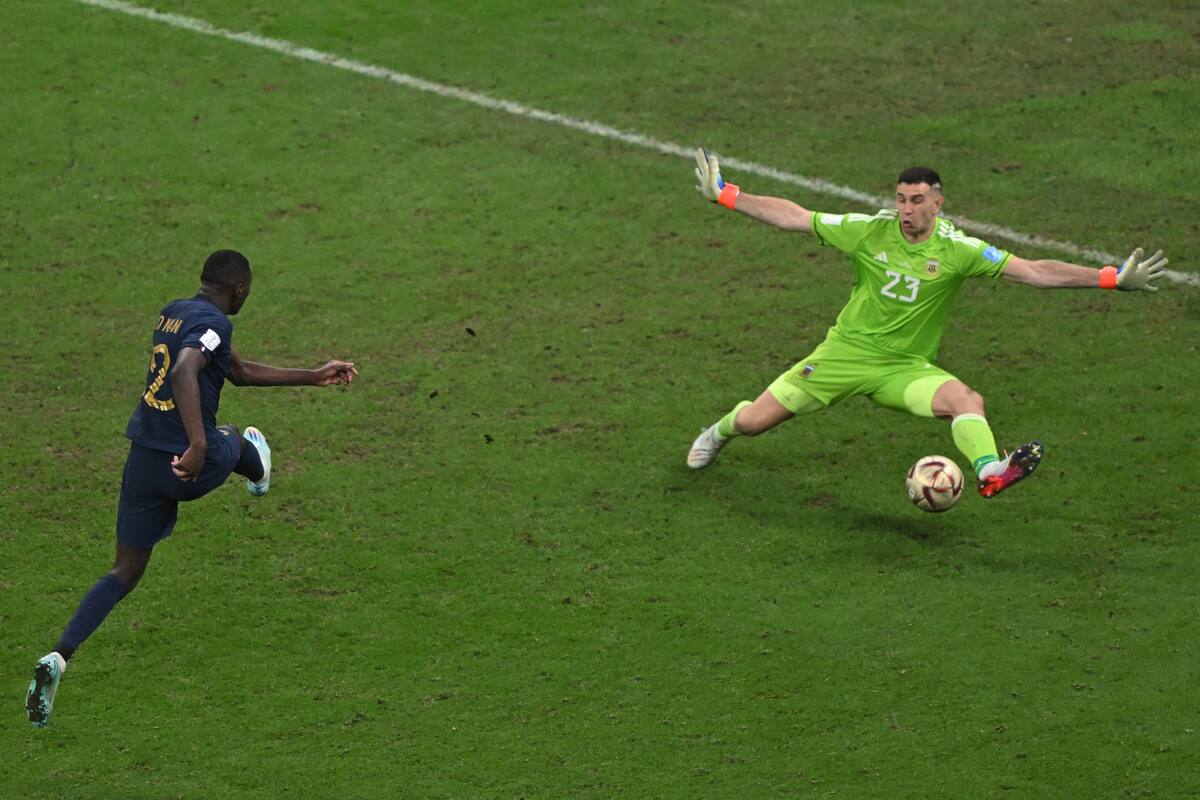 18 December 2022, Qatar, Lusail: Soccer, World Cup, Argentina - France, final round, final, Lusail Stadium, France's Randal Kolo Muani and Argentina's goalkeeper Emiliano Martinez in duel. Photo: Robert Michael/dpa (Photo by Robert Michael/picture alliance via Getty Images)