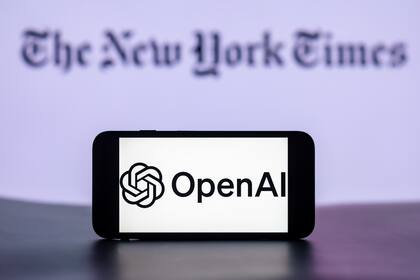 2024/01/01: In this photo illustration, the OpenAI logo is seen displayed on a mobile phone screen with the New York Times Logo in the background. (Photo Illustration by Idrees Abbas/SOPA Images/LightRocket via Getty Images)