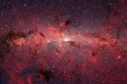 25-05-2021 Imagen del centro de la galaxia obtenida con el telescopio espacial Spitzer, donde se pueden ver zonas de
Nubes moleculares, entre ellas, la nube en la que se ha descubierto la etanolamina. POLITICA INVESTIGACIÓN Y TECNOLOGÍA JPL/ NASA