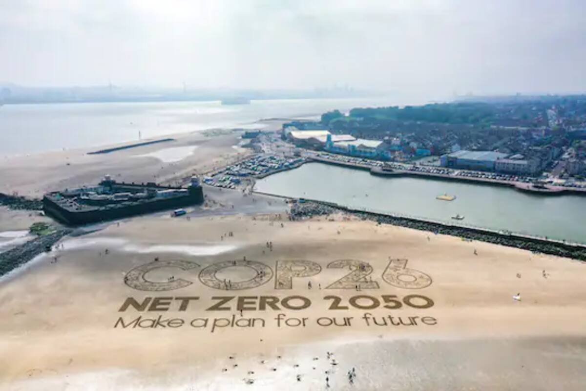 A giant sand artwork adorns New Brighton Beach in the United Kingdom last month, urging world leaders to commit to ambitious plans to cut greenhouse gas emissions ahead of the United Nations' 26th Climate Change Conference, in Glasgow in November. (Christopher Furlong/Getty Images)
