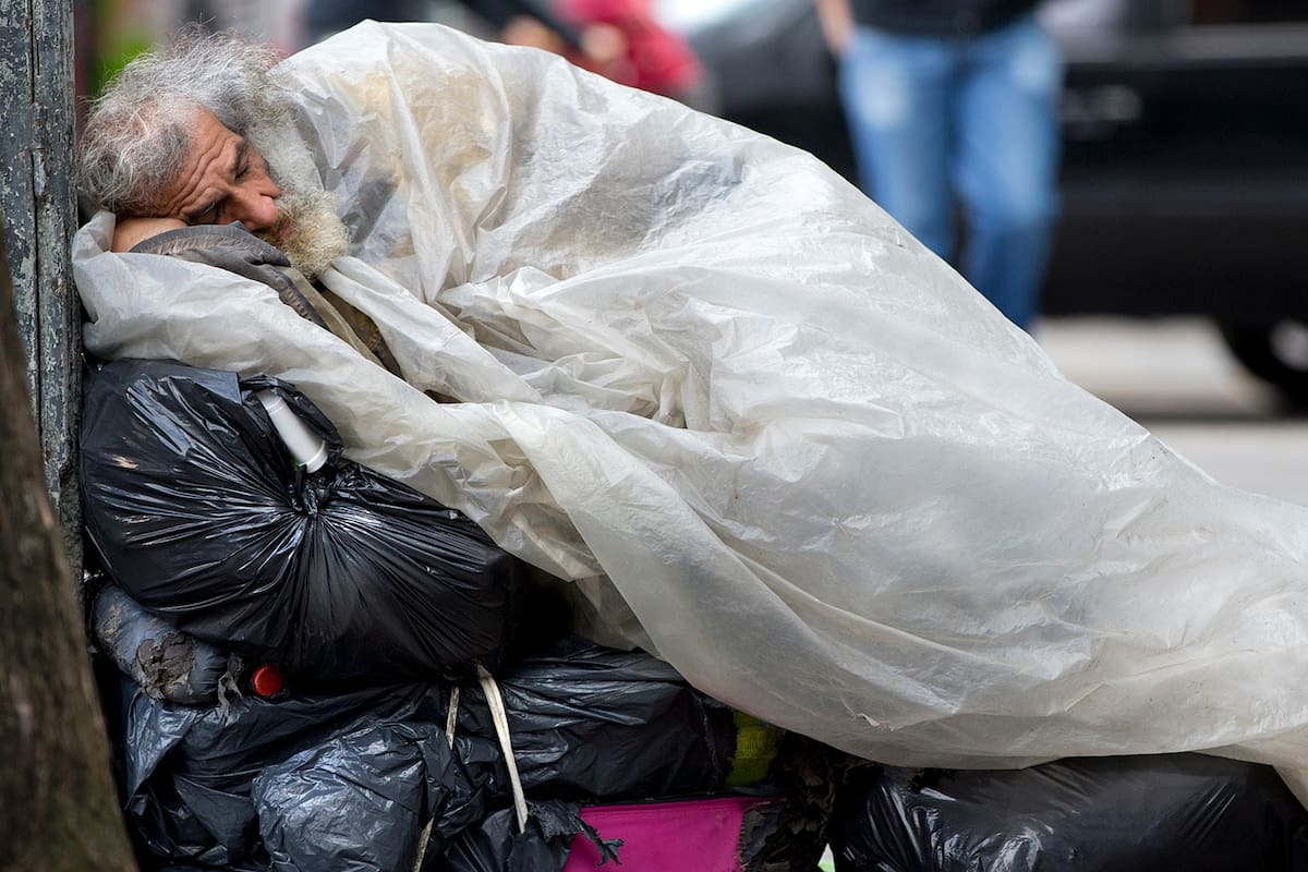 a homeless man sleeps on top of his belongings on the sidewalk, early in the morning in Buenos Aires, Argentina. The president of the World Bank recently praised President Mauricio Macri''''''''''''''''s efforts at providing clear data as a crucial step to reduce poverty