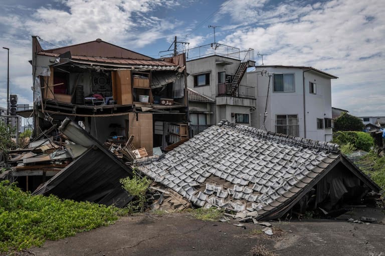 A house lies collapsed in Yatsushiro, Kumamoto prefecture on July 29, 2026, after an earthquake struck southwestern Japan the previous day. (Photo by Yuichi YAMAZAKI / AFP)