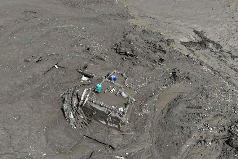 A house lies deluged in sludge after flash floods at Trishuli Bazar in Nepal's Nuwakot district on August 26, 2026. Massive flooding killed eight people in Nepal on August 26, as Chinese state media reported "major casualties" from a mudslide at a Tibet trade hub on China's side of the nations' shared border. (Photo by Prabin RANABHAT / AFP)