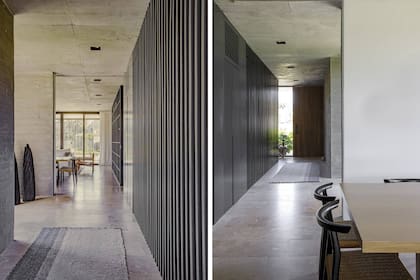 ‘‘A la derecha del hall, un frente laqueado organiza los espacios: primero, contiene una escalera revestida en varillas; luego, integra una entrada de servicio. Más adelante, se convierte en biblioteca”, dicen desde el Estudio MMS. Esculturas en madera quemada (Primitiva). Alfombra (Elementos Argentinos).