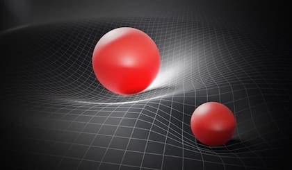 A la luz de la relatividad general, los físicos nos invitan a imaginar una gran tela suspendida en el aire, en la que una pelota hace que se hunda: el espacio-tiempo se deforma por ella
