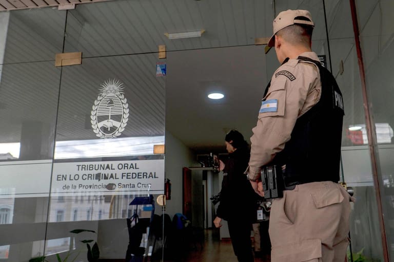 A member of the Argentine Naval Prefecture guards the entrance to the courtroom of the trial on the sinking of the ARA San Juan submarine on November 15, 2017 where 44 members of the Argentine Navy died, in Rio Gallegos, Santa Cruz, Argentina on March 3, 2026. Argentina opens a trial on March 3 into a submarine implosion that killed 44 sailors in November 2017, the country's worst naval disaster in decades, and whose circumstances remain unclear. (Photo by Walter Diaz / AFP)