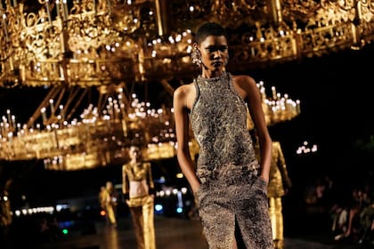 A model wears a creation as part of the Saint Laurent Womenswear Spring Summer 2027 collection presented in Paris, France, Tuesday, Sept. 29, 2026. (AP Photo/Teresa Suarez)