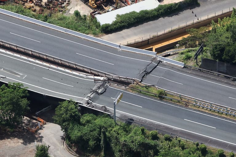 A section of a damaged expressway is seen in Yatsushiro, Kumamoto Prefecture, on July 29, 2026, after an earthquake struck southwestern Japan the previous day. (Photo by JIJI PRESS / AFP) / Japan OUT