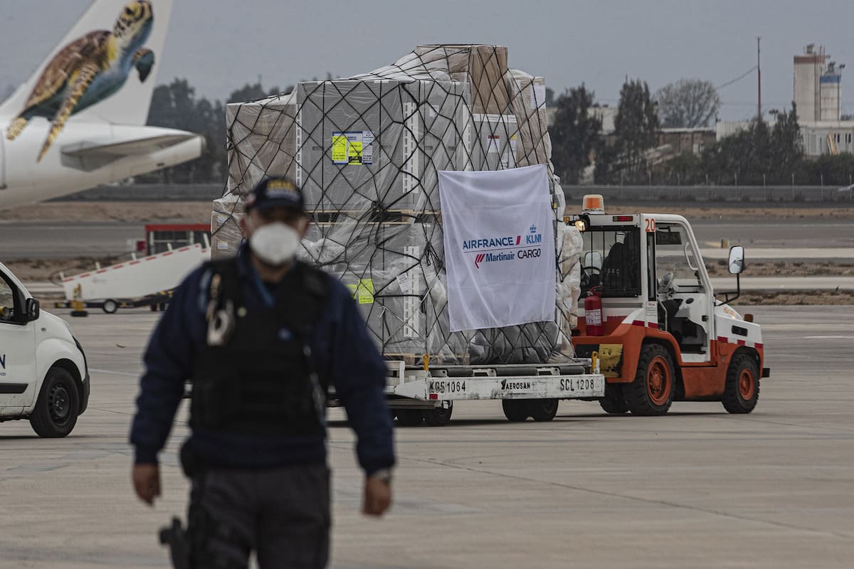 A truck transports a first shipment of the AstraZeneca COVID-19 vaccine after its arrival at the Arturo Merino Benitez International Airport, in Santiago, Chile, Friday, April 23, 2021. (AP Photo/Esteban Felix)