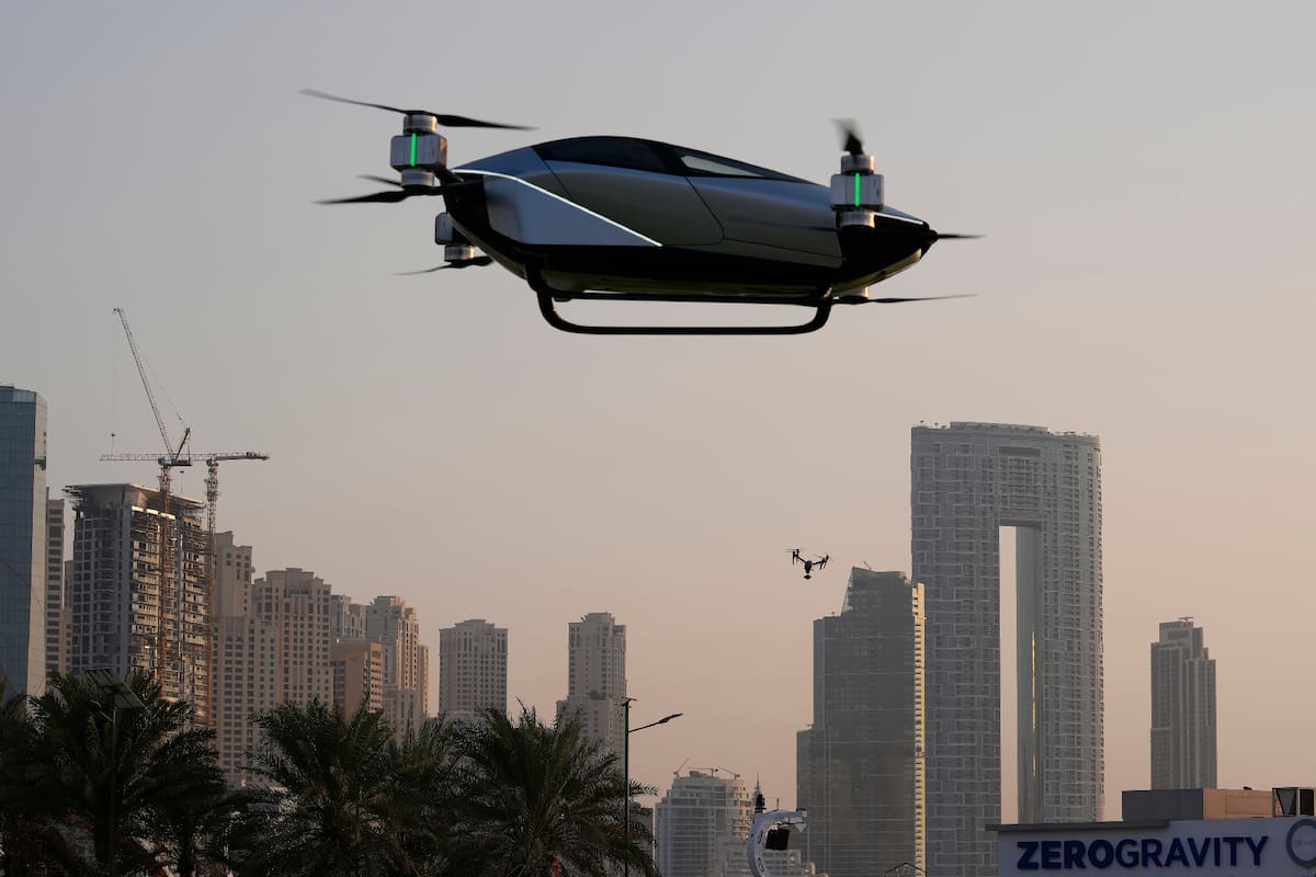 A XPeng X2, an electric flying taxi developed by the Guangzhou-based XPeng, Inc's aviation affiliate, is tested in front of the Marina District in Dubai, United Arab Emirates, Monday, Oct. 10, 2022. Monday’s demonstration was held with an empty cockpit, but the company says it carried out a manned flight test last year of the two-passenger vehicle. (AP Photo/Kamran Jebreili)