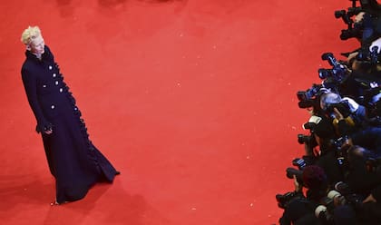 Actress Tilda Swinton poses for photographers upon arrival at the opening of the International Film Festival, Berlinale, in Berlin, Thursday, Feb. 13, 2025. (Sebastian Christoph Gollnow/dpa via AP)