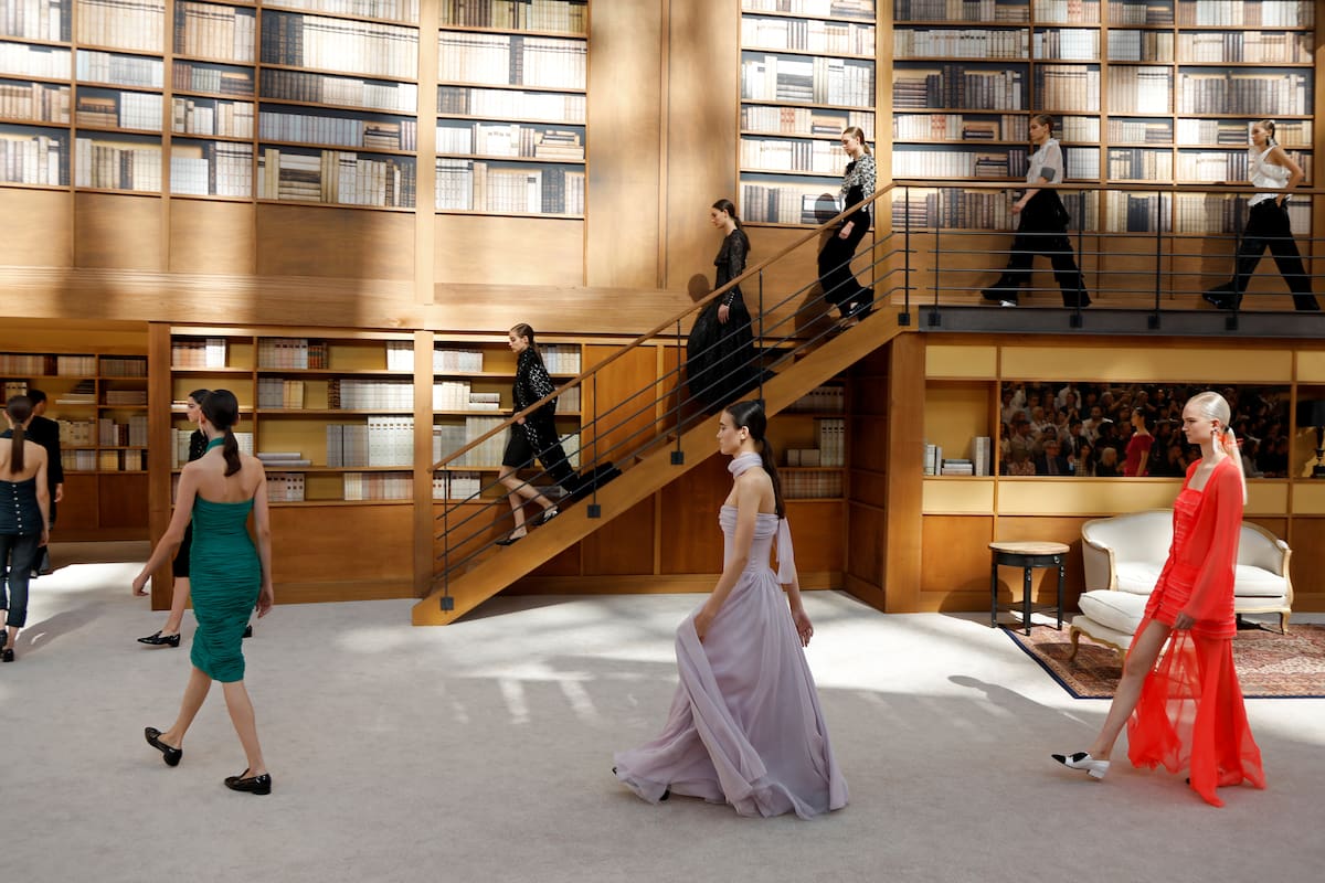 AFP_1I737AModels present creations by Chanel during the Women''s Fall-Winter 20192020 Haute Couture collection fashion show at the Grand Palais turned into a giant library in Paris, on July 2, 2019. (Phot