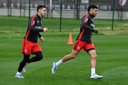 Agustín Palavecino y Enzo Pérez, en un entrenamiento de River