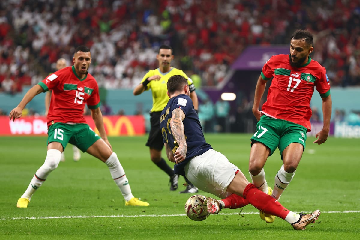 AL KHOR, QATAR - DECEMBER 14: Theo Hernandez of France competes with Sofiane Boufal of Morocco during the FIFA World Cup Qatar 2022 semi final match between France and Morocco at Al Bayt Stadium on December 14, 2022 in Al Khor, Qatar. (Photo by Chris Brunskill/Fantasista/Getty Images)