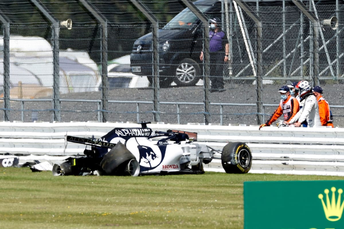 Alpha Tauri driver Daniil Kvyat of Russia stands on the right after crashing during the British Formula One Grand Prix at the Silverstone racetrack, Silverstone, England, Sunday, Aug. 2, 2020.