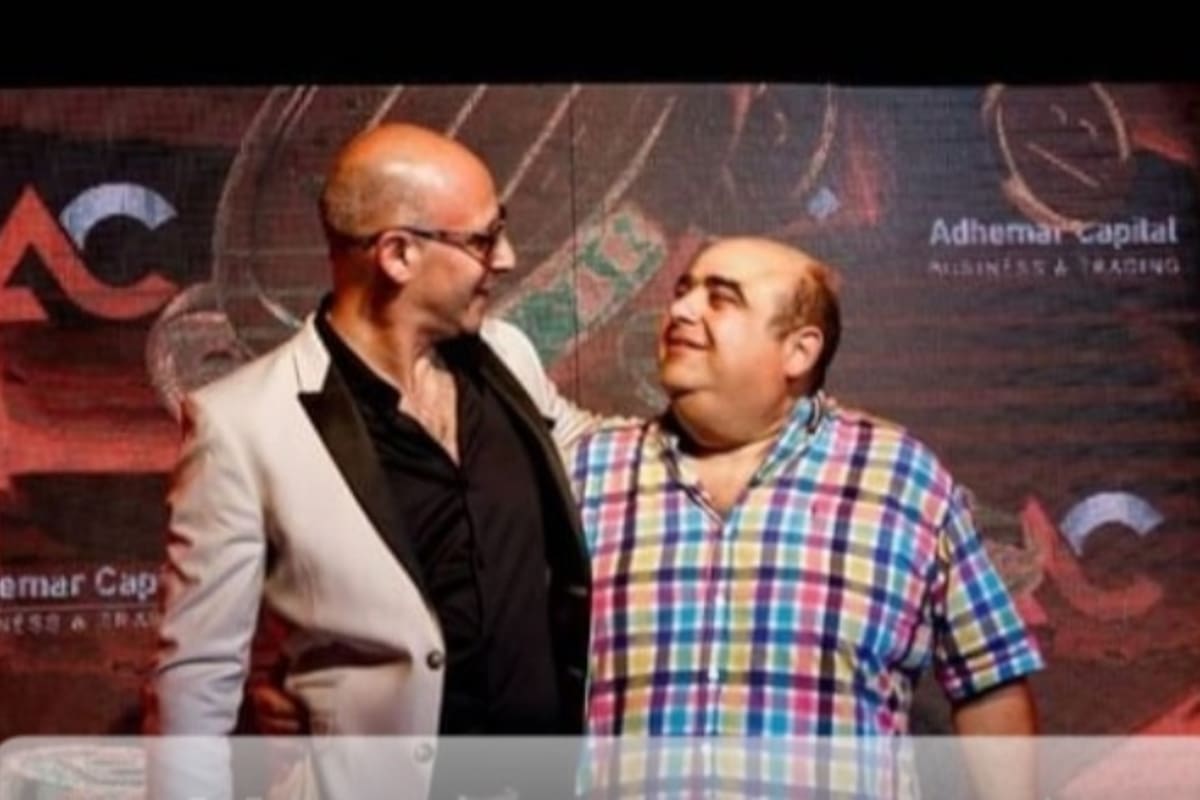 Andrés Emilio Jalil, hermano del gobernador Raúl Jalil, con Adhemar en una presentación.