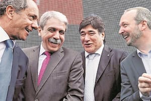 Aníbal Fernández y Carlos Zannini, durante la campaña 2015, junto a Daniel Scioli y Martín Sabbatella