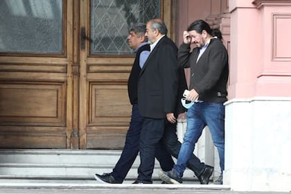Héctor Daer y Pablo Moyano, el año pasado, en la Casa Rosada, cuando se anunció un alivio en el impuesto a las ganancias