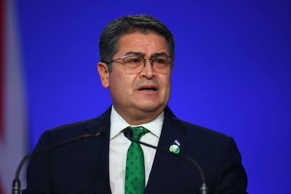 ARCHIVO - El presidente de Honduras, Juan Orlando Hernández, habla durante la ceremonia de apertura de la Conferencia COP26 de la ONU sobre Cambio Climático en Glasgow, Escocia, el lunes 1 de noviembre de 2021. (Andy Buchanan/Pool vía AP, Archivo)
