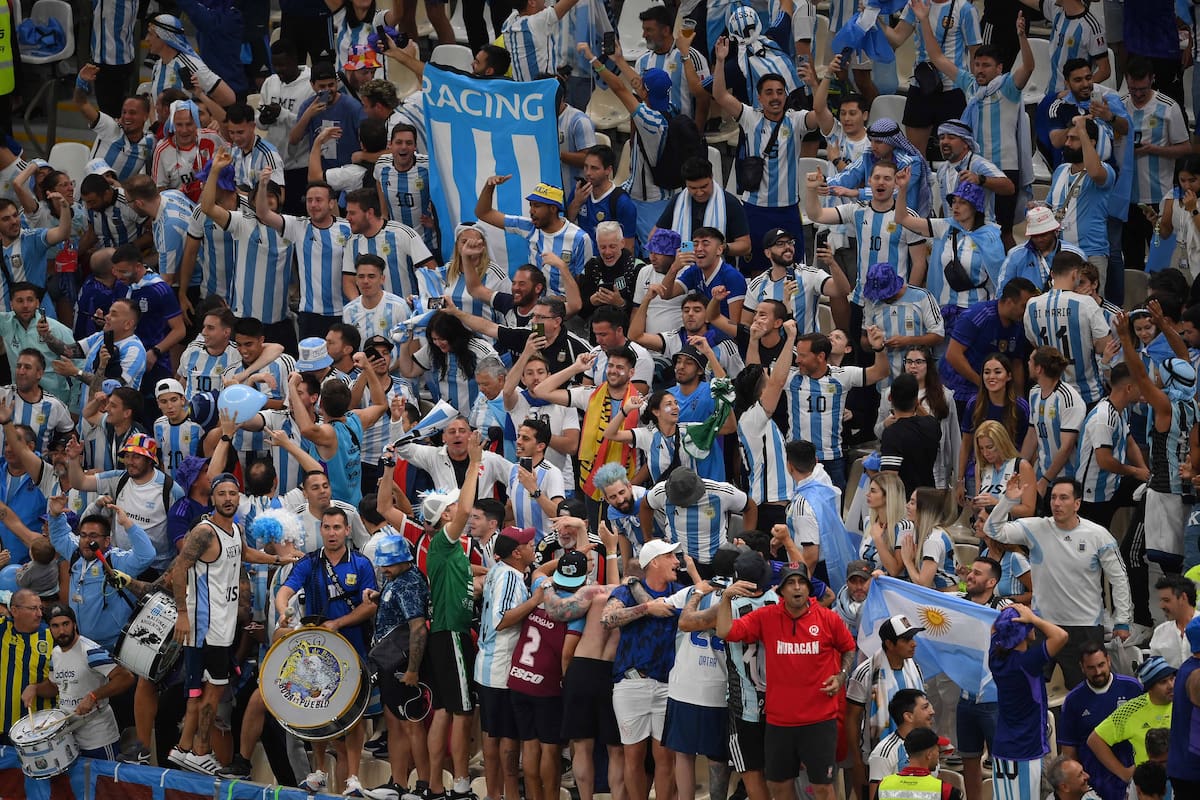 Argentina fans cheer prior to the Qatar 2022 World Cup quarter-final football match between The Netherlands and Argentina at Lusail Stadium, north of Doha on December 9, 2022. (Photo by FRANCK FIFE / AFP)