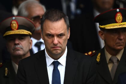 Argentina's Chief of Cabinet Manuel Adorni attends a ceremony to commemorate the 44th anniversary of the war between Argentina and the United Kingdom over the Falkland Islands (called Las Malvinas by Argentina) at the 'Cenotaph to the Fallen of the Malvinas War' in Buenos Aires on April 2, 2026. (Photo by Luis ROBAYO / AFP)