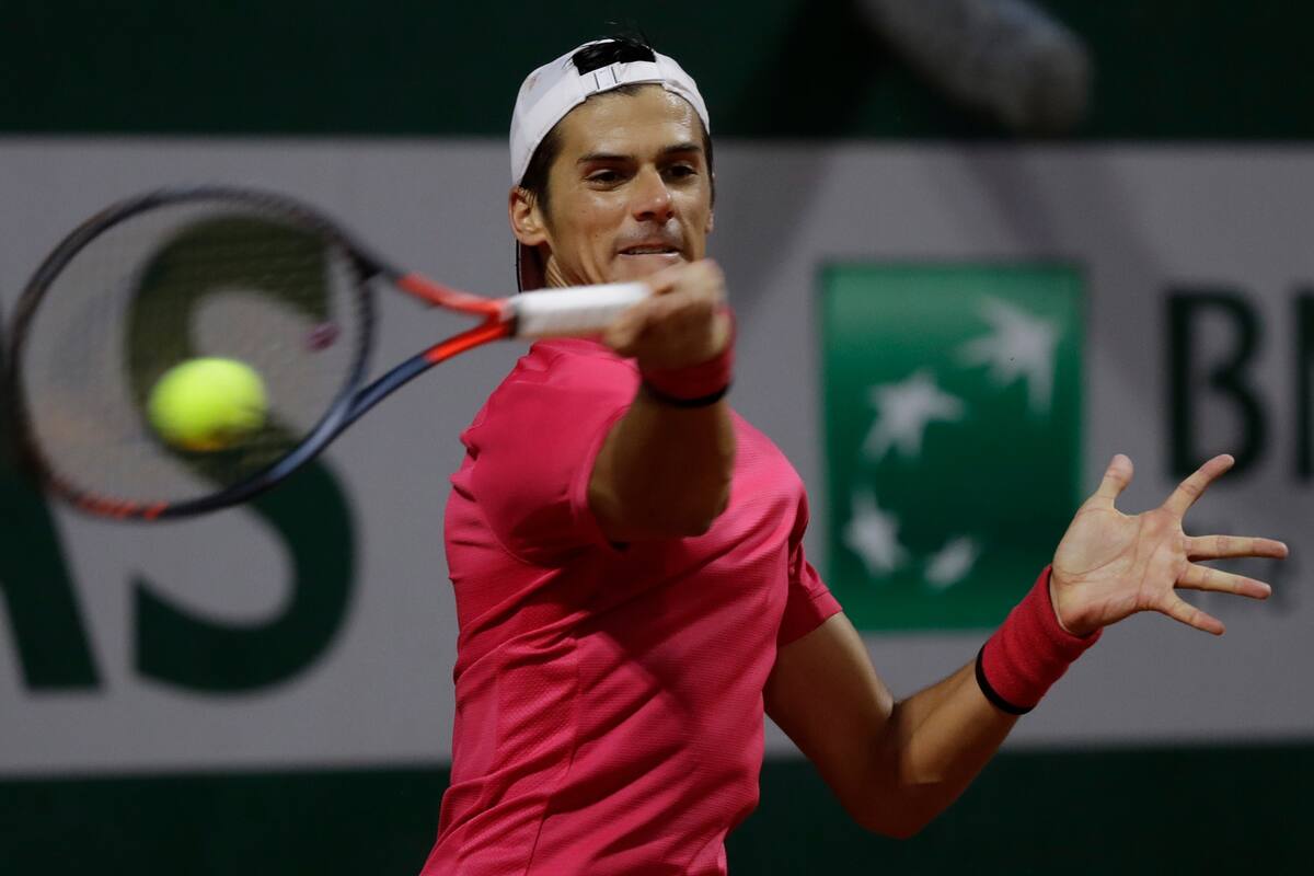Argentinas Federico Coria plays a shot against Italys Jannik Sinner in the third round match of the French Open tennis tournament at the Roland Garros stadium in Paris, France, Friday, Oct. 2, 2020.