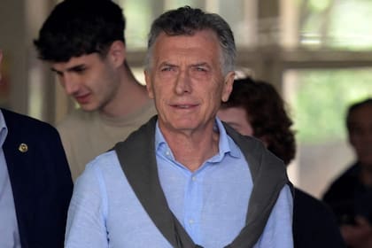 Argentina's former president (2015-2019) Mauricio Macri gestures while leaving the polling station in Buenos Aires, during the presidential election runoff on November 19, 2023. Desperate for a way out of a crippling economic crisis, Argentines began voting Sunday in a nail-biter election between embattled Economy Minister Sergio Massa and the libertarian outsider Javier Milei. (Photo by JUAN MABROMATA / AFP)