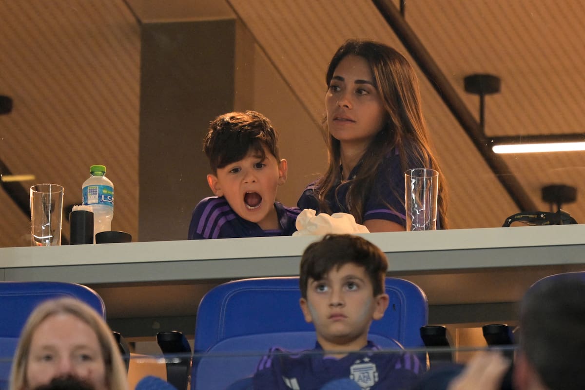 Argentina's forward #10 Lionel Messi's wife Antonela Roccuzzo and children Ciro (L) and Thiago (bottom) sit in the tribune as they wait for the start of the Qatar 2022 World Cup Group C football match between Poland and Argentina at Stadium 974 in Doha on November 30, 2022. (Photo by JUAN MABROMATA / AFP)
