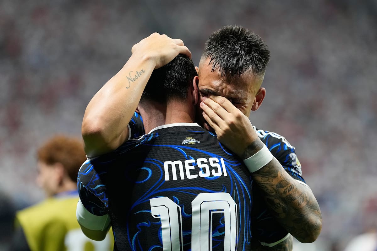 Argentina's Lautaro Martinez hugs teammate Lionel Messi celebrating after scoring their side's second goal during the World Cup semifinal soccer match between England and Argentina in Atlanta, Wednesday, July 15, 2026. (AP Photo/Rebecca Blackwell)