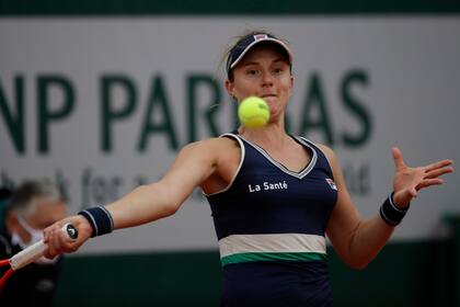 Argentinas Nadia Podoroska plays a shot against Slovakias Anna Karolina Schmiedlova in the third round match of the French Open tennis tournament at the Roland Garros stadium in Paris, France, Friday, Oct. 2, 2020.