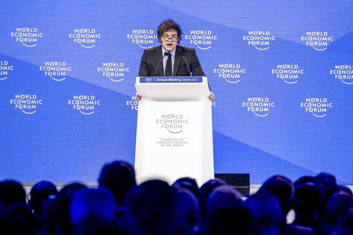 Argentina’s President Javier Milei addresses the audience during the World Economic Forum (WEF) annual meeting in Davos on January 23, 2025. Milei said at a Bloomberg event on January 22, 2026 that "The world should celebrate the arrival of President Trump,"before Donald Trump will star on January 23, 2025 in an eagerly-anticipated online appearance at the World Economic Forum in Davos, addressing global elites whose annual gabfest has been consumed by the US president's days-old second term. (Photo by FABRICE COFFRINI / AFP)