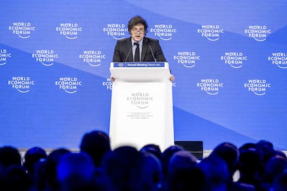 Argentina’s President Javier Milei addresses the audience during the World Economic Forum (WEF) annual meeting in Davos on January 23, 2025. Milei said at a Bloomberg event on January 22, 2026 that "The world should celebrate the arrival of President Trump,"before Donald Trump will star on January 23, 2025 in an eagerly-anticipated online appearance at the World Economic Forum in Davos, addressing global elites whose annual gabfest has been consumed by the US president's days-old second term. (Photo by FABRICE COFFRINI / AFP)