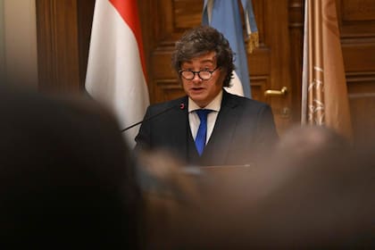 Argentina’s President Javier Milei holds the acceptance speech after receiving his honorary doctorate from the Ludovika University of Public Service in Budapest on March 21, 2026, on the sidelines of the Conservative Political Action Conference (CPAC). (Photo by Attila KISBENEDEK / AFP)