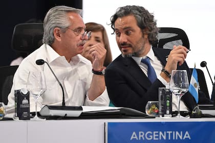 Argentinian President Alberto Fernandez (L) and his Foreing Minister Santiago Cafiero  attend the plenary session of the XXVIII Ibero-American Summit of Heads of State and Government at the Dominican Foreign Ministry building in Santo Domingo, on March 25, 2023. (Photo by Federico Parra / AFP)
