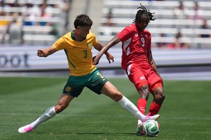 Australia defender Alessandro Circati (3) battles Switzerland midfielder Johan Manzambi for the ball during the second half of an international friendly soccer game Saturday, June 6, 2026, in San Diego. (AP Photo/Gregory Bull)