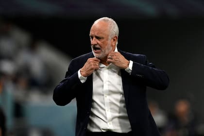 Australia's coach #00 Graham Arnold shouts instructions to his players from the touchline during the Qatar 2022 World Cup round of 16 football match between Argentina and Australia at the Ahmad Bin Ali Stadium in Al-Rayyan, west of Doha on December 3, 2022. (Photo by Alfredo ESTRELLA / AFP)