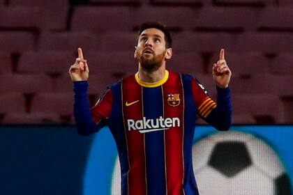 Barcelonas Lionel Messi celebrates after scoring the opening goal during the Spanish La Liga soccer match between FC Barcelona and Elche at the Camp Nou stadium in Barcelona, Spain, Wednesday, Feb. 24, 2021. (AP Photo/Joan Monfort)