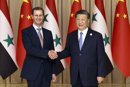 Bashar al-Assad y Xi Jinping, en su encuentro en Hangzhou, China. (Yao Dawei/Xinhua via AP)