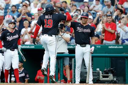 Bell y Lile lideran a Nacionales en victoria 10-8 sobre Rojos