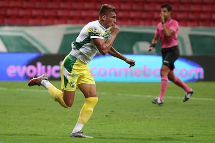 Braian Romero of Argentina's Defensa y Justicia celebrates after scoring his side's opening goal during the Recopa Sudamericana final second leg soccer match at the Mane Garrincha stadium in Brasilia, Brazil, Wednesday, April 14, 2021. (Buda Mendes/Pool via AP)