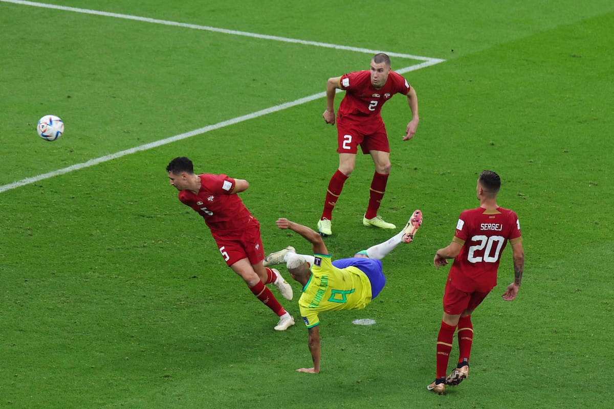 Brazil's forward #09 Richarlison scores his team's second goal during the Qatar 2022 World Cup Group G football match between Brazil and Serbia at the Lusail Stadium in Lusail, north of Doha on November 24, 2022. (Photo by Giuseppe CACACE / AFP)