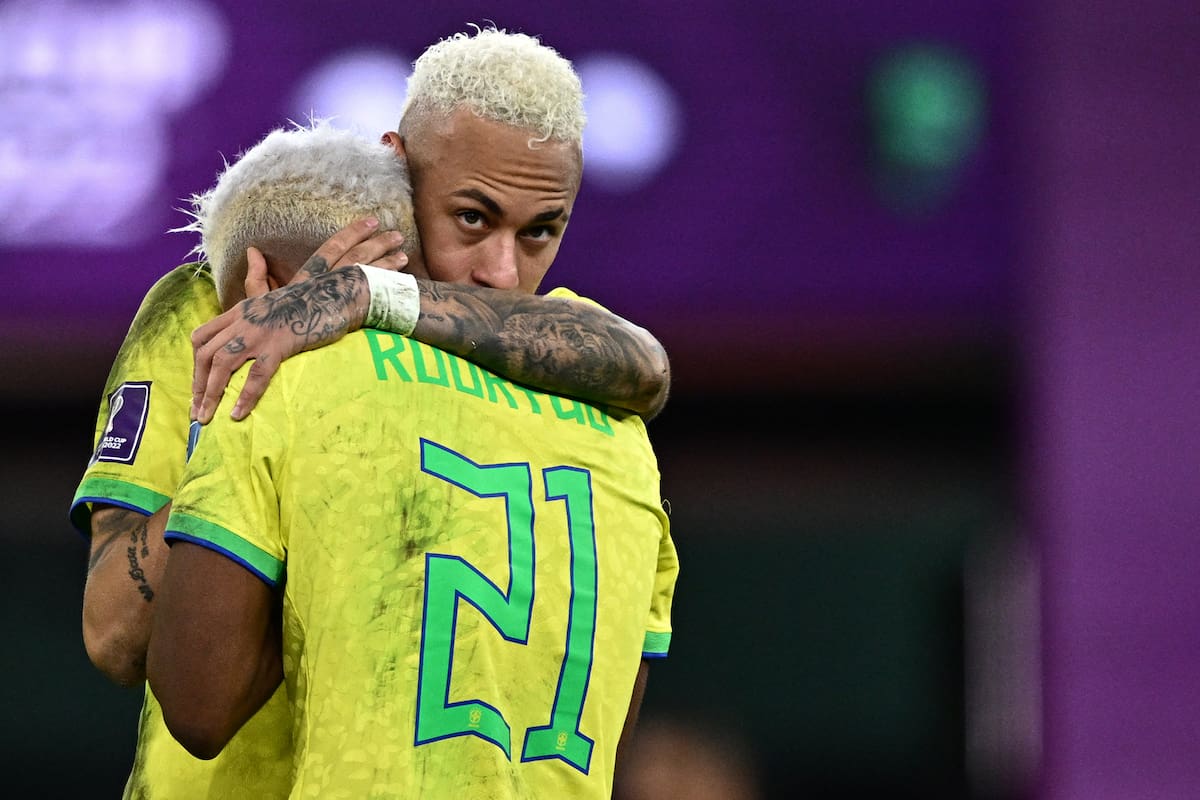 Brazil's forward #10 Neymar comforts Brazil's forward #21 Rodrygo after losing in the penalty shoot-out after extra-time of the Qatar 2022 World Cup quarter-final football match between Croatia and Brazil at Education City Stadium in Al-Rayyan, west of Doha, on December 9, 2022. (Photo by GABRIEL BOUYS / AFP)
